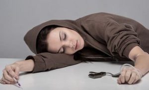 women passed out from using heroin