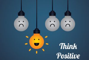 think positive written next to light bulbs